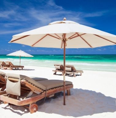 white sand beach with chairs